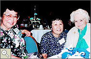 Photo of three women sitting at a table 