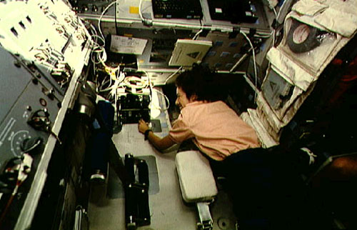 Astronaut Ellen Ochoa works with ATMOS experiment checkout 