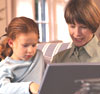 A woman and Child infront of a computer